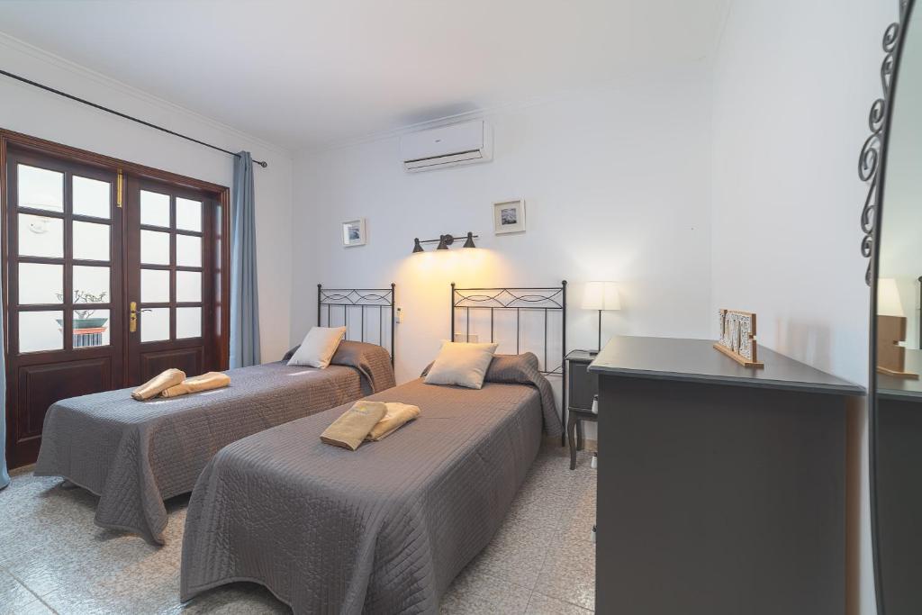 Postel nebo postele na pokoji v ubytování Villa Victoria