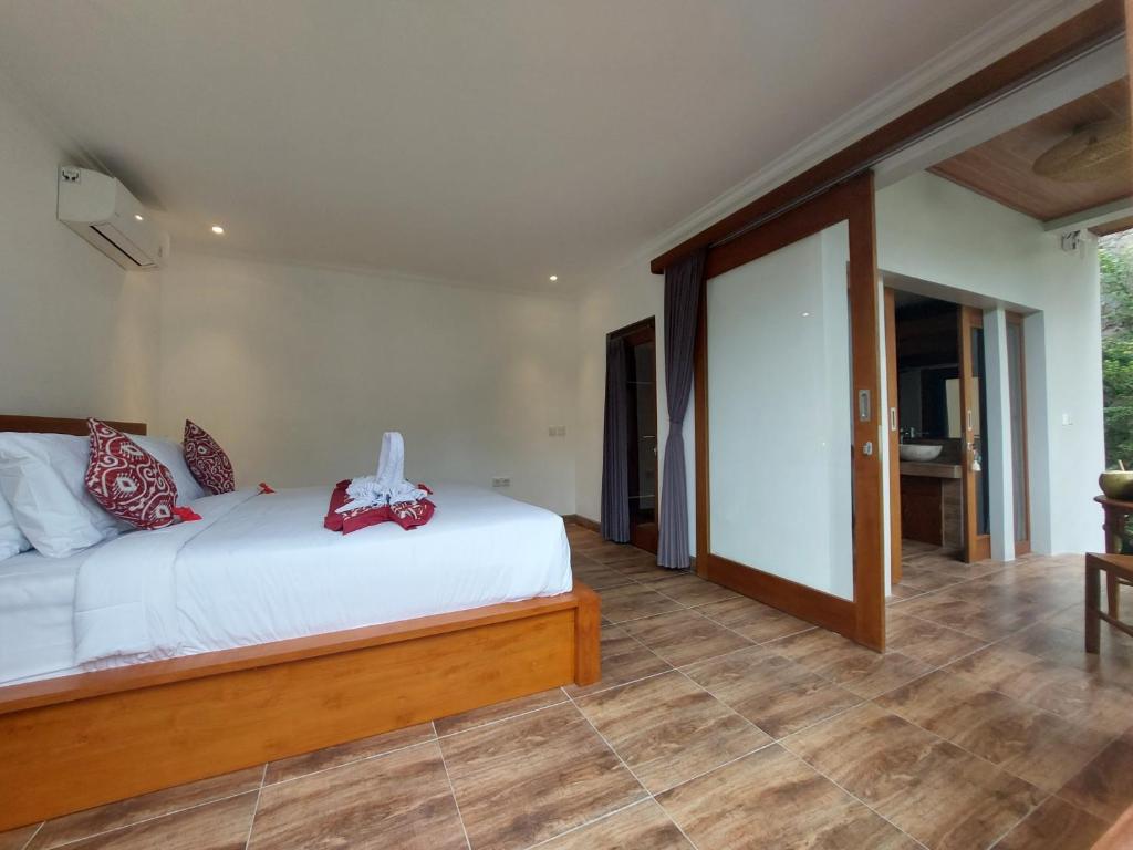 Postel nebo postele na pokoji v ubytování Prema Shiva Suites and Villas by EPS