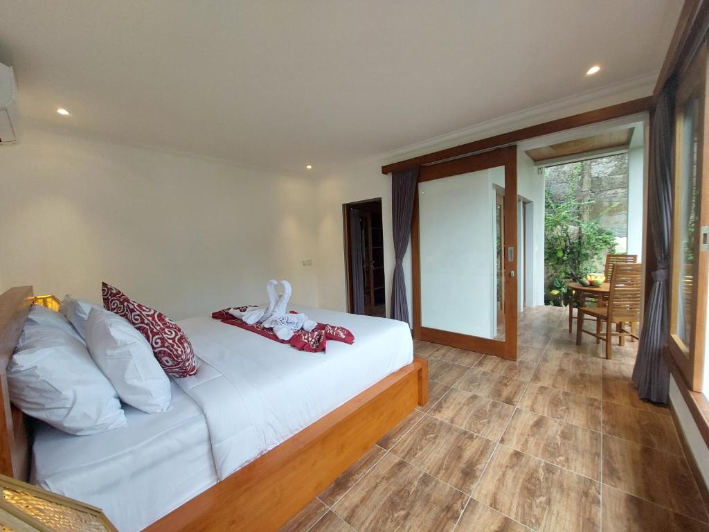 Postel nebo postele na pokoji v ubytování Prema Shiva Suites and Villas by EPS