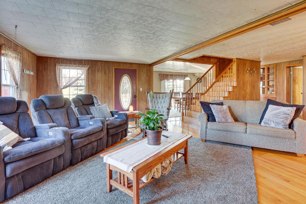 a living room with couches and a coffee table at Charming Dundee Vacation Rental Near Hiking! in Dundee