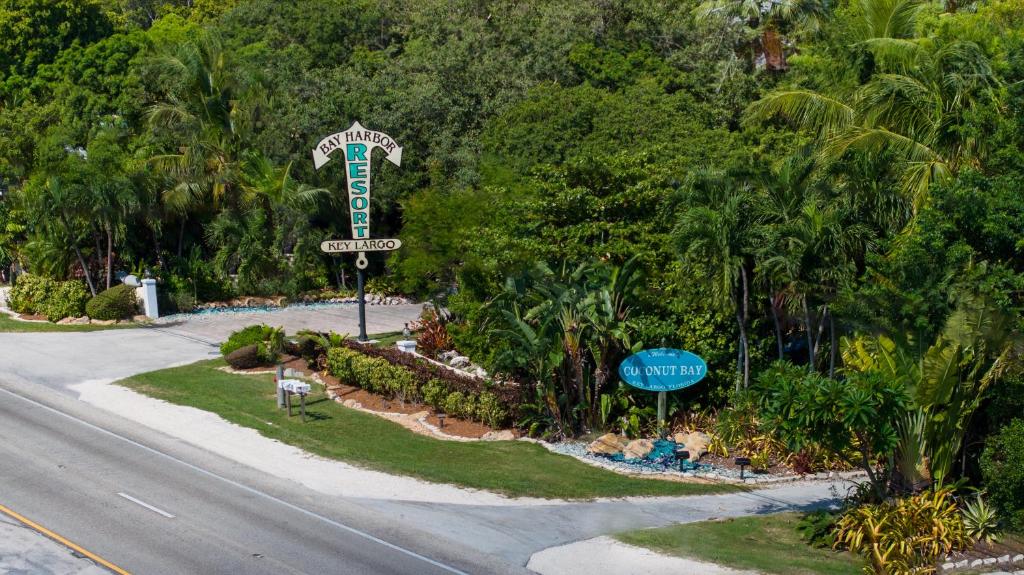 a sign for a hotel on the side of a road at Bay Harbor Lodge in Key Largo