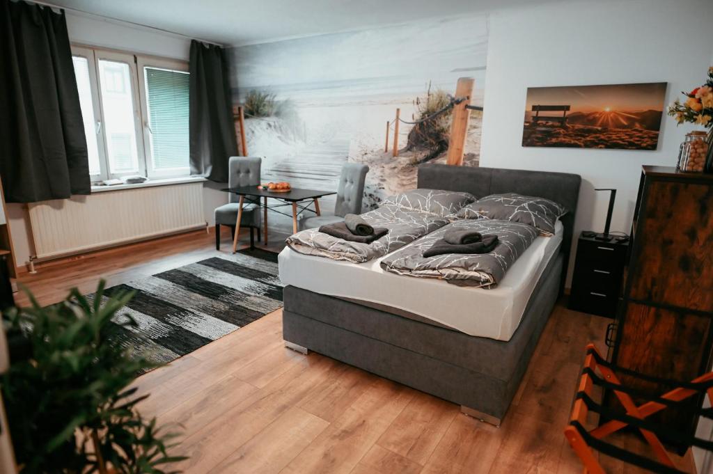 a bedroom with a bed and a living room at Vienna Stadthalle Apartment 19 in Vienna