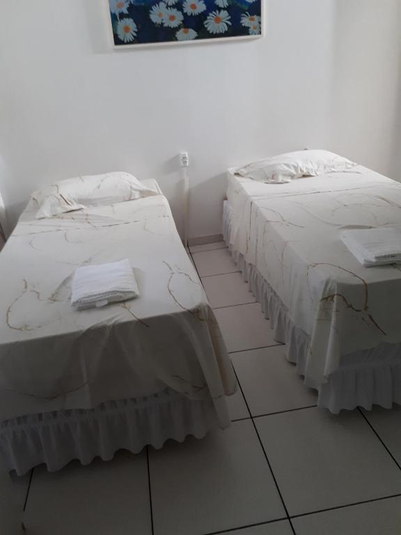 Postel nebo postele na pokoji v ubytování Grand Prix Hotel