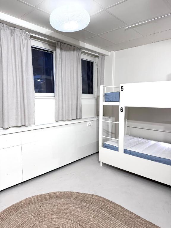 Postel nebo postele na pokoji v ubytování Nomad Gardet