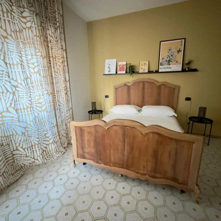 Postel nebo postele na pokoji v ubytování TERRA DI SUD Matera