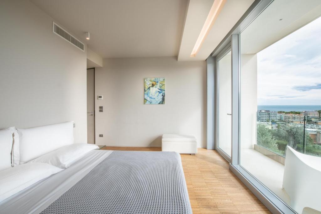 Postel nebo postele na pokoji v ubytování ALKIMIA boutique hotel