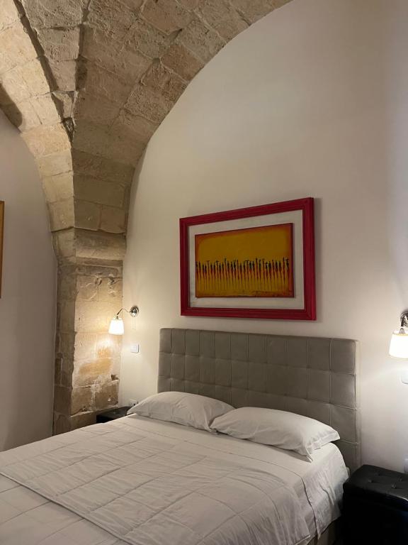 Ένα ή περισσότερα κρεβάτια σε δωμάτιο στο La Tarantella Salentina