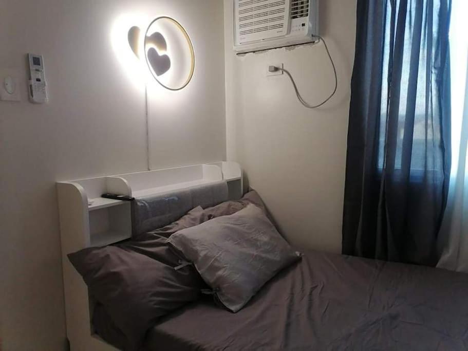 Кровать или кровати в номере Calculated Comfort Space