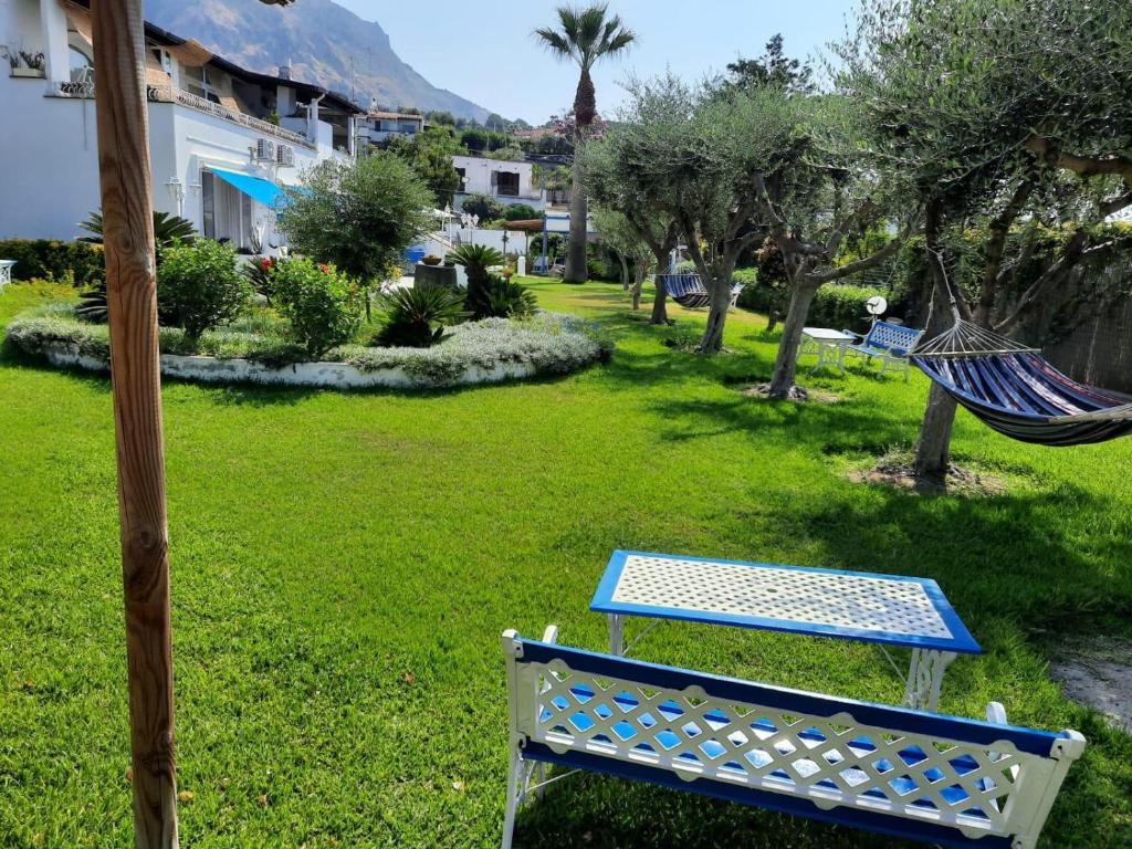 a hammock and a swing in a yard at Fantasy House 2.0 in Forio d'Ischia