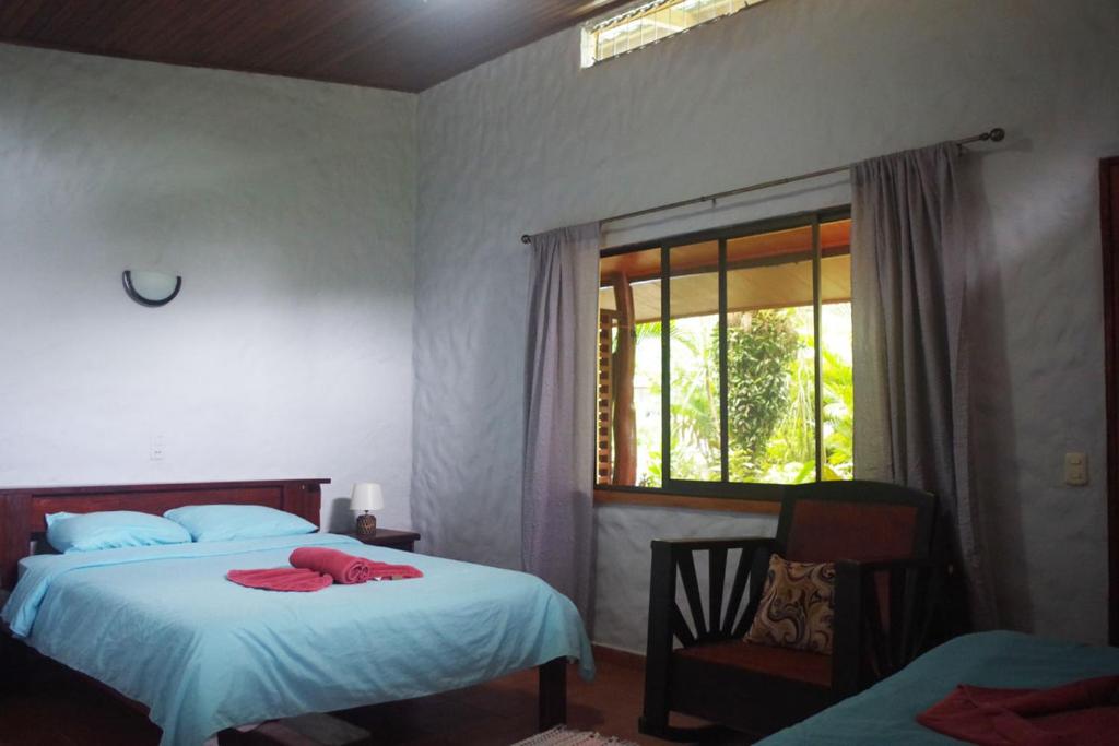 Postel nebo postele na pokoji v ubytování Casa Caribbean Coconut