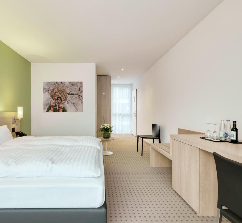 Voodi või voodid majutusasutuse Hotel Eastside (free parking garage) toas