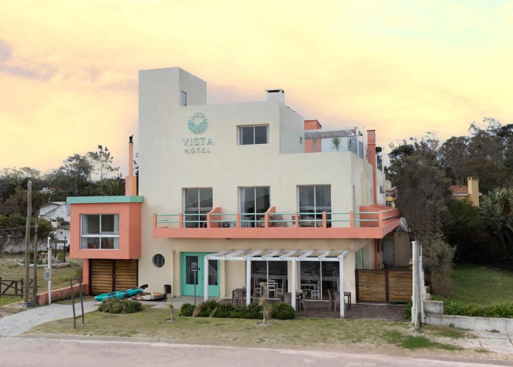 a large white building with a sign on it at Hotel Vista La Floresta in La Floresta