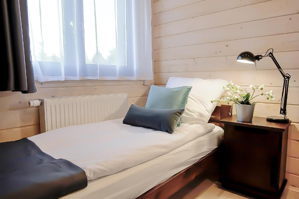 Postel nebo postele na pokoji v ubytování Ośrodek Wypoczynkowy IDA