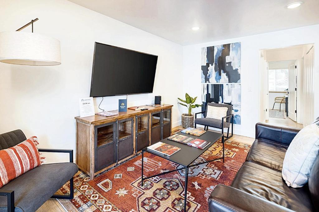 a living room with a large flat screen tv at Near Downtown Stylish 2BR With Amazing Patio - 3 in Moab