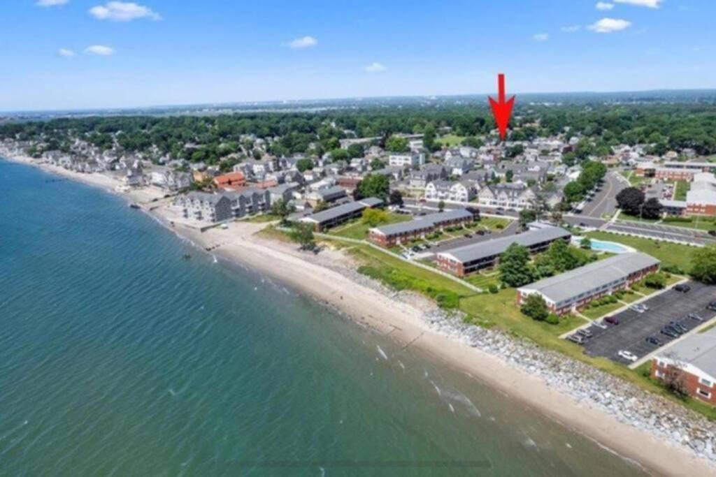 an aerial view of a beach with a red object at Bobby's Beach Bungalow in Milford