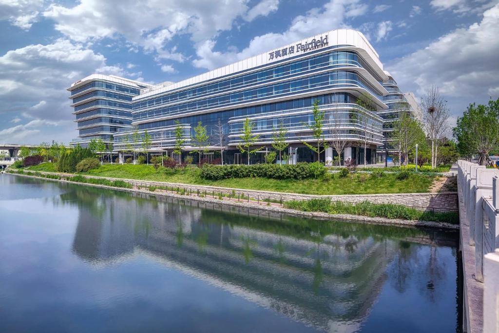 a large building with a river in front of it at Fairfield by Marriott Beijing Daxing Airport in Beijing