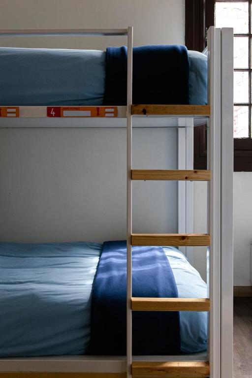 Postel nebo postele na pokoji v ubytování Pariwana Hostel Santiago