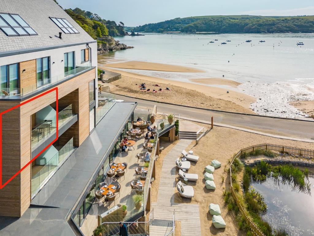 an aerial view of a beach and a building at Four The Reach in Salcombe