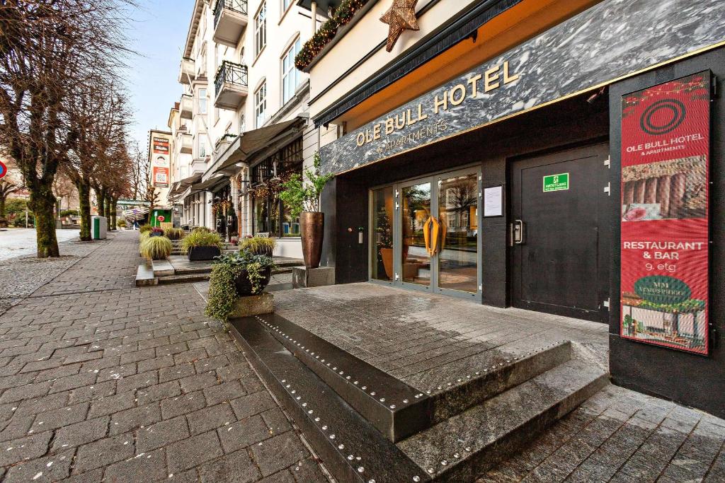 a store on a street with stairs in front of it at Ole Bull, Best Western Signature Collection in Bergen