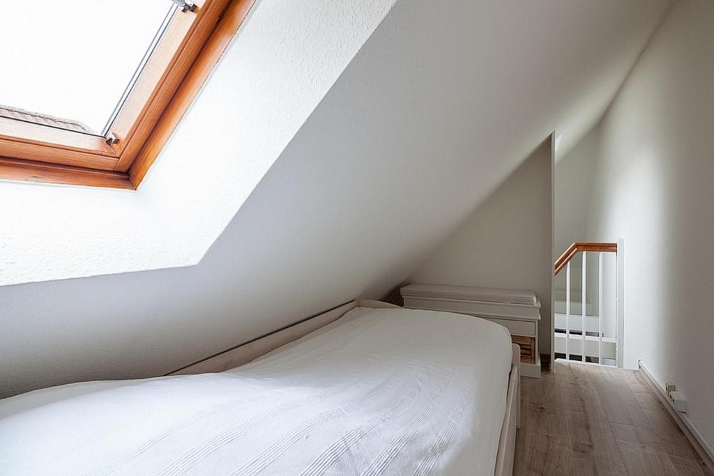 Postel nebo postele na pokoji v ubytování Strandhus Strandhus