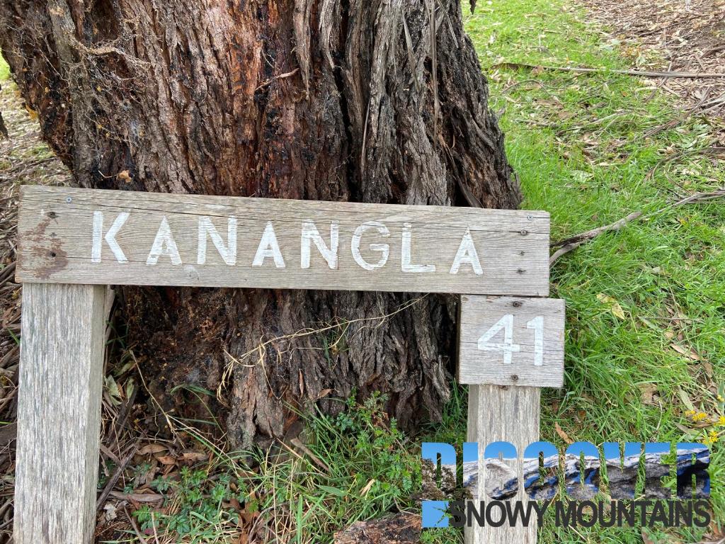 a wooden sign in front of a tree at Kanangla in Anglers Reach