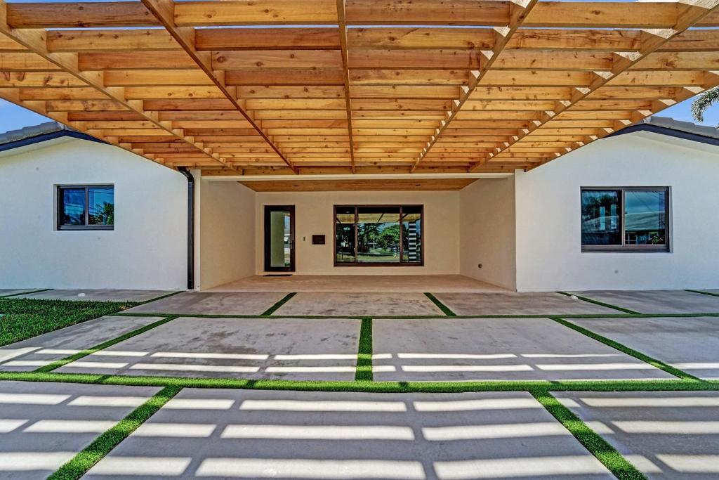 an empty house with a wooden ceiling at Once Upon a Tide - Just Minutes to the Beach in Dania Beach