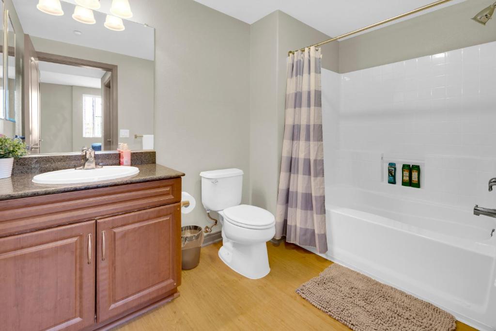 a bathroom with a sink and a toilet and a tub at San Diego 2 Bedroom Walk to the Mall in San Diego