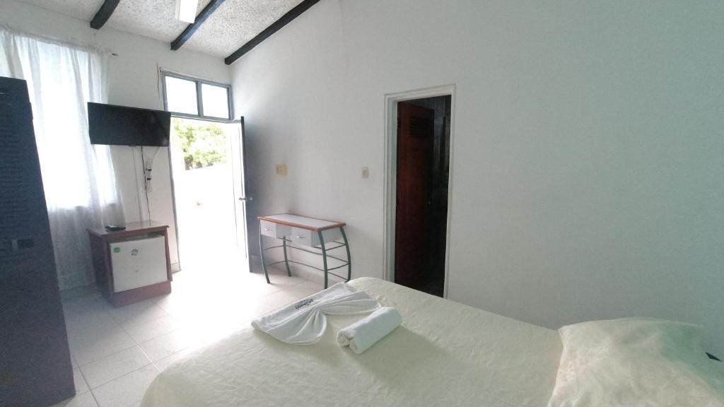 Postel nebo postele na pokoji v ubytování Hotel Miami en Melgar