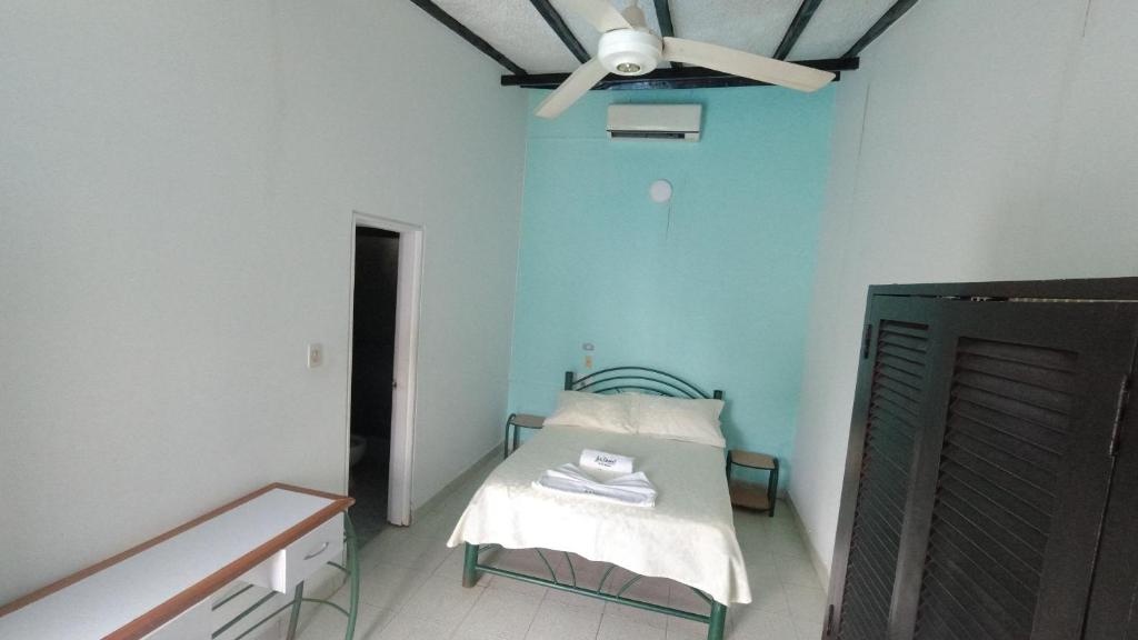 Postel nebo postele na pokoji v ubytování Hotel Miami en Melgar