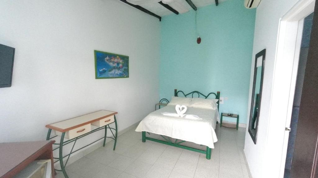 Postel nebo postele na pokoji v ubytování Hotel Miami en Melgar