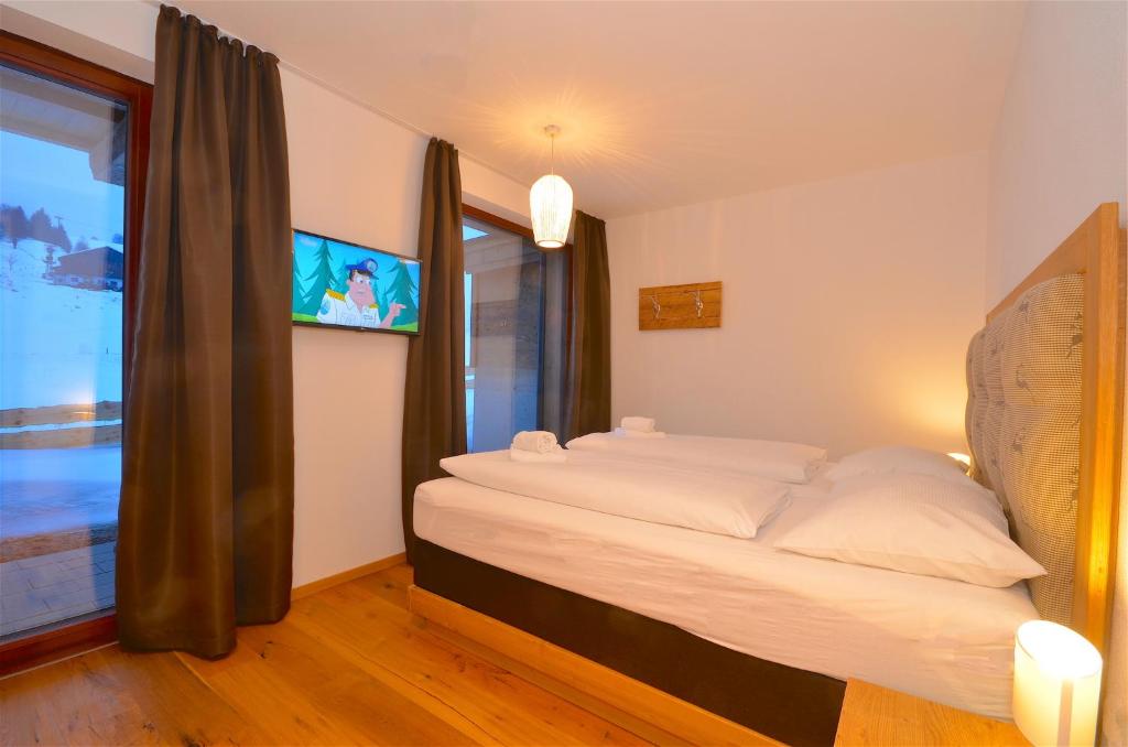 Posteľ alebo postele v izbe v ubytovaní Ski-in Ski-out Chalet Maiskogel 13B - by Alpen Apartments