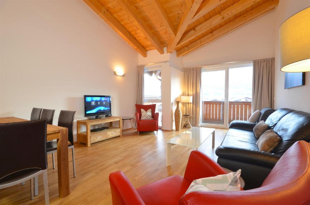 Televízia a/alebo spoločenská miestnosť v ubytovaní APT Mountain View by - Alpen Apartments
