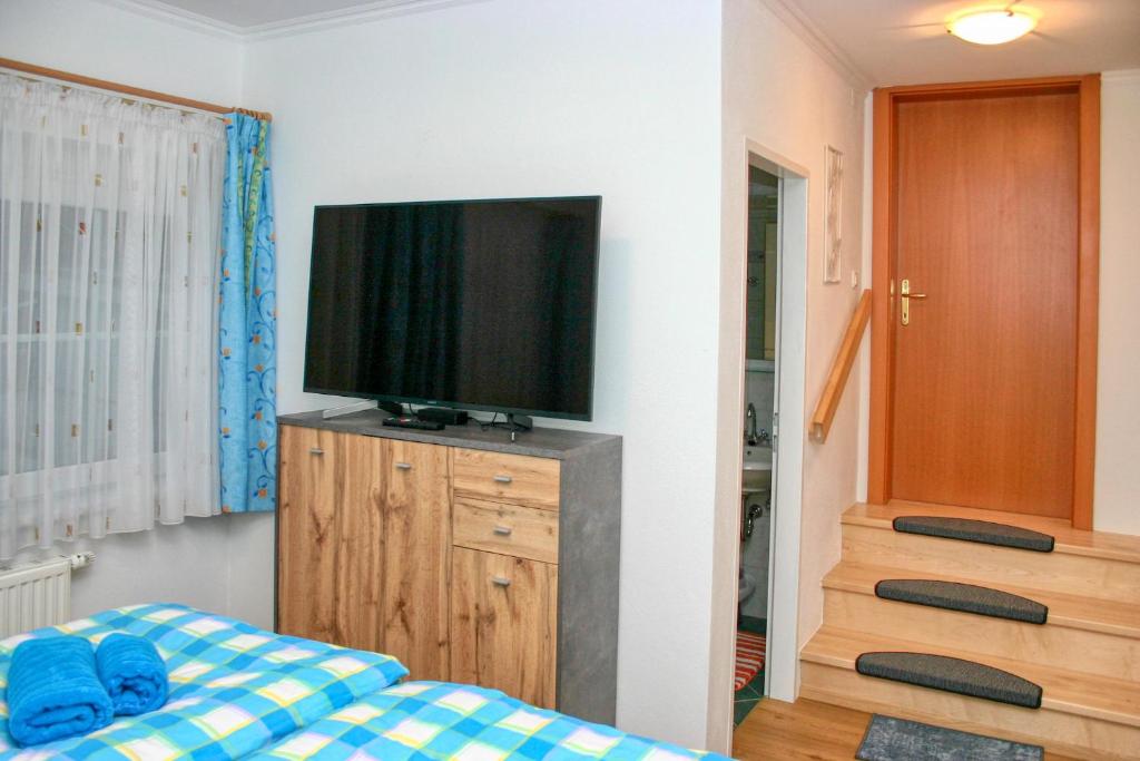 Televízia a/alebo spoločenská miestnosť v ubytovaní Apartment Birke 3 - by Alpen Apartments