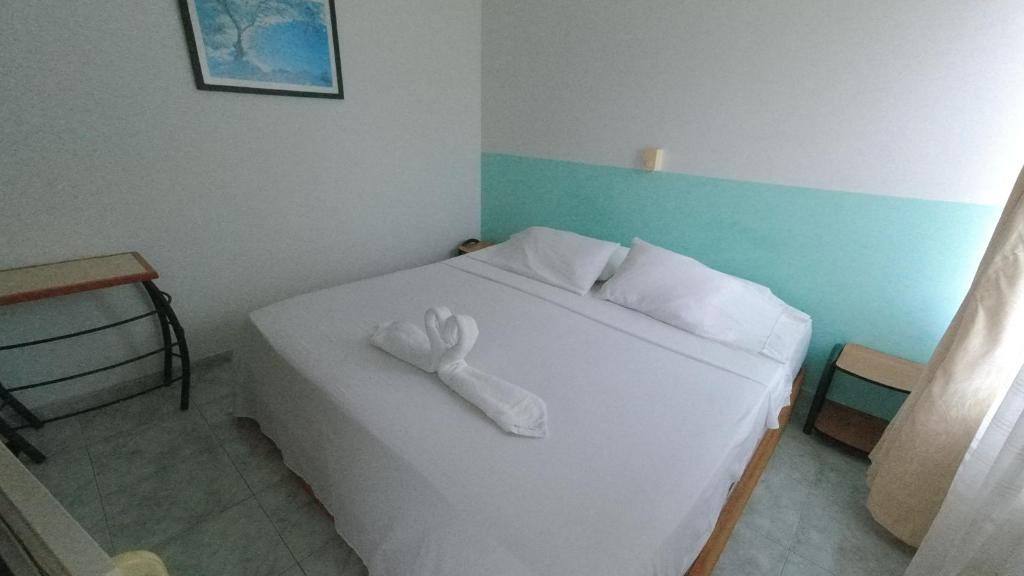Postel nebo postele na pokoji v ubytování Hotel Miami en Melgar