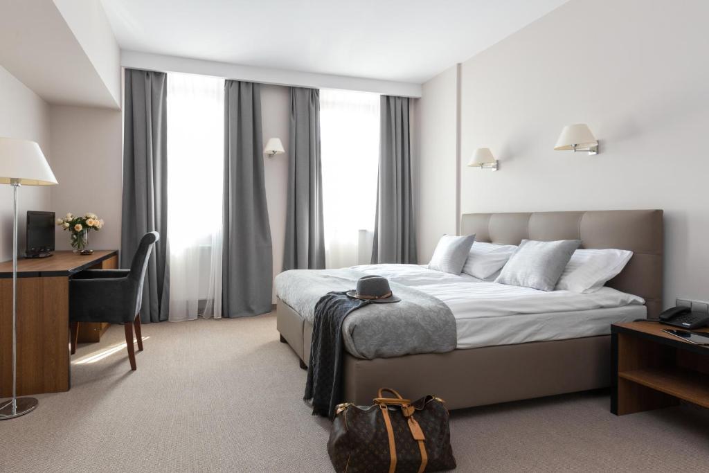 Posteľ alebo postele v izbe v ubytovaní Grottger Luxury Boutique Hotel City