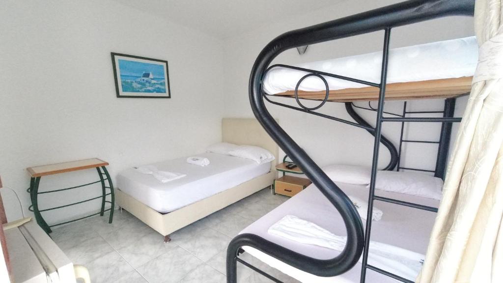 Postel nebo postele na pokoji v ubytování Hotel Miami en Melgar