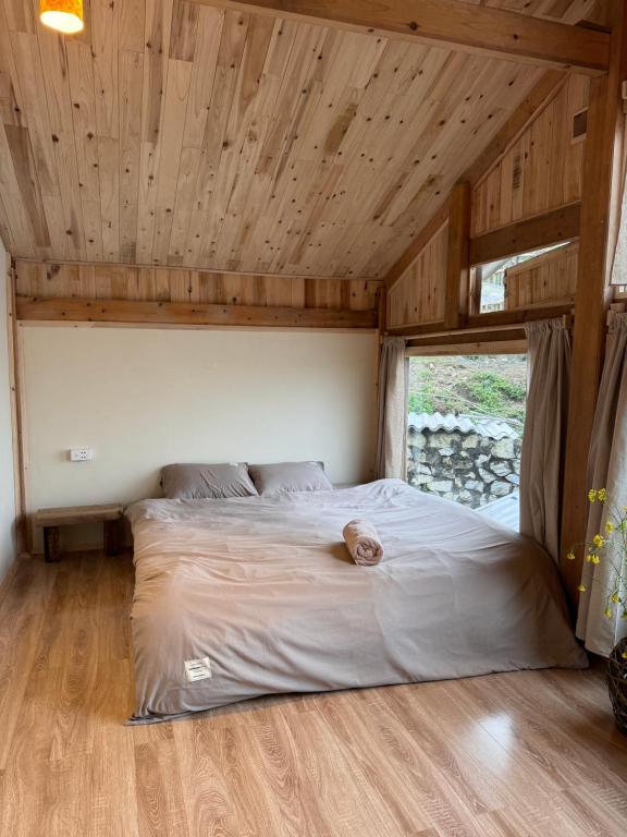 Postel nebo postele na pokoji v ubytování DE MONG SAPA