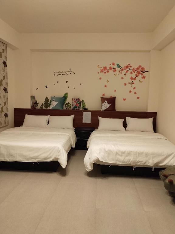 Postel nebo postele na pokoji v ubytování Ke Lai Inn B&B