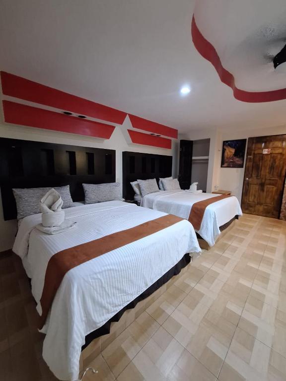 Postel nebo postele na pokoji v ubytování Hotel San Rafael