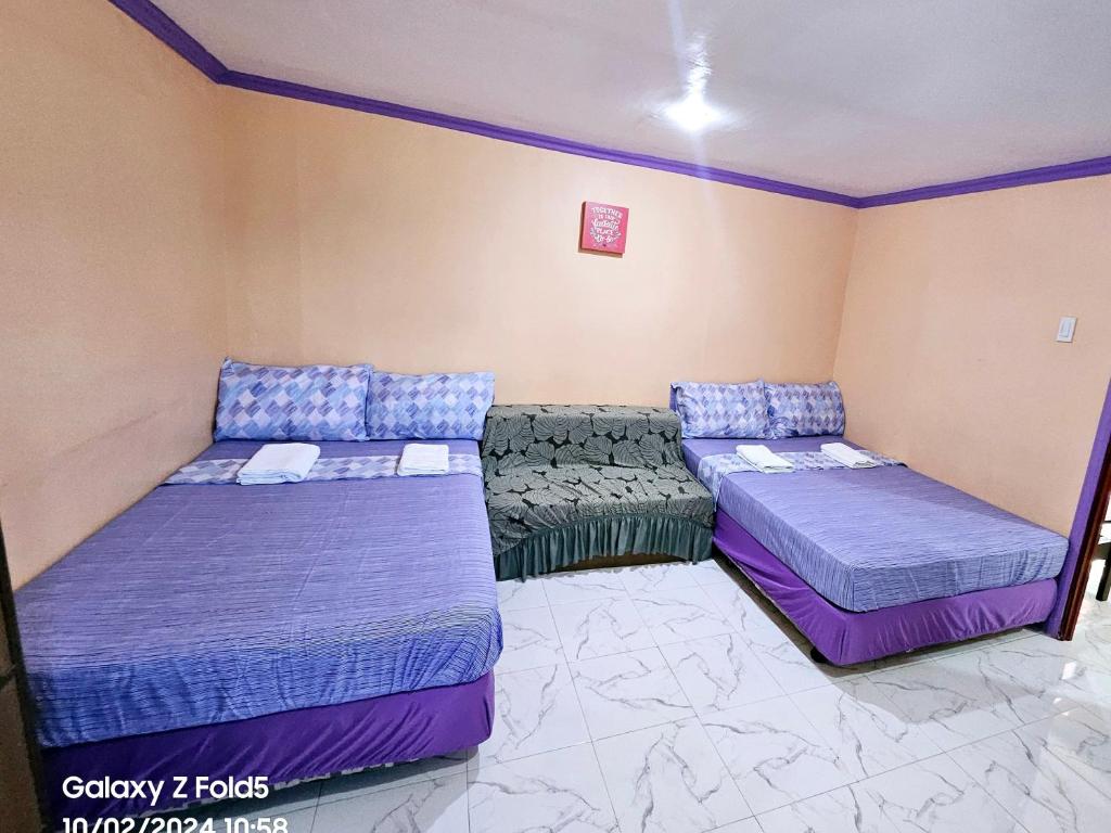 Postel nebo postele na pokoji v ubytování Einel Homestay 1