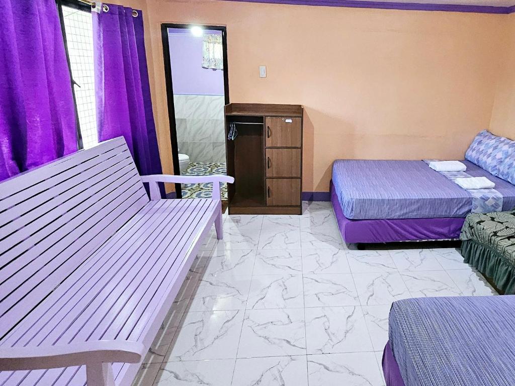 Postel nebo postele na pokoji v ubytování Einel Homestay 1