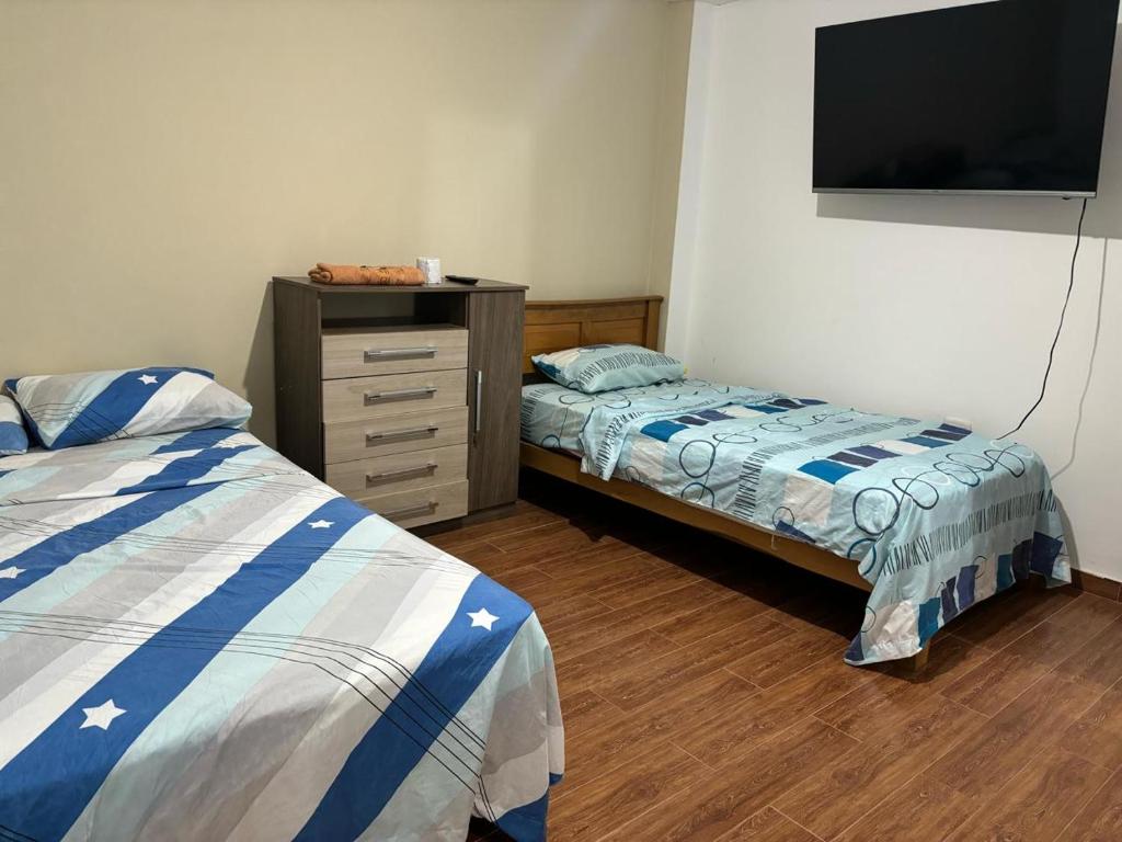 En eller flere senge i et værelse på La casita del naufrago