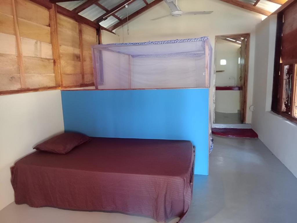 Postel nebo postele na pokoji v ubytování Breezy Beach Cabanas