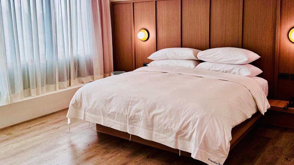 Postel nebo postele na pokoji v ubytování Hope Hotel Tainan