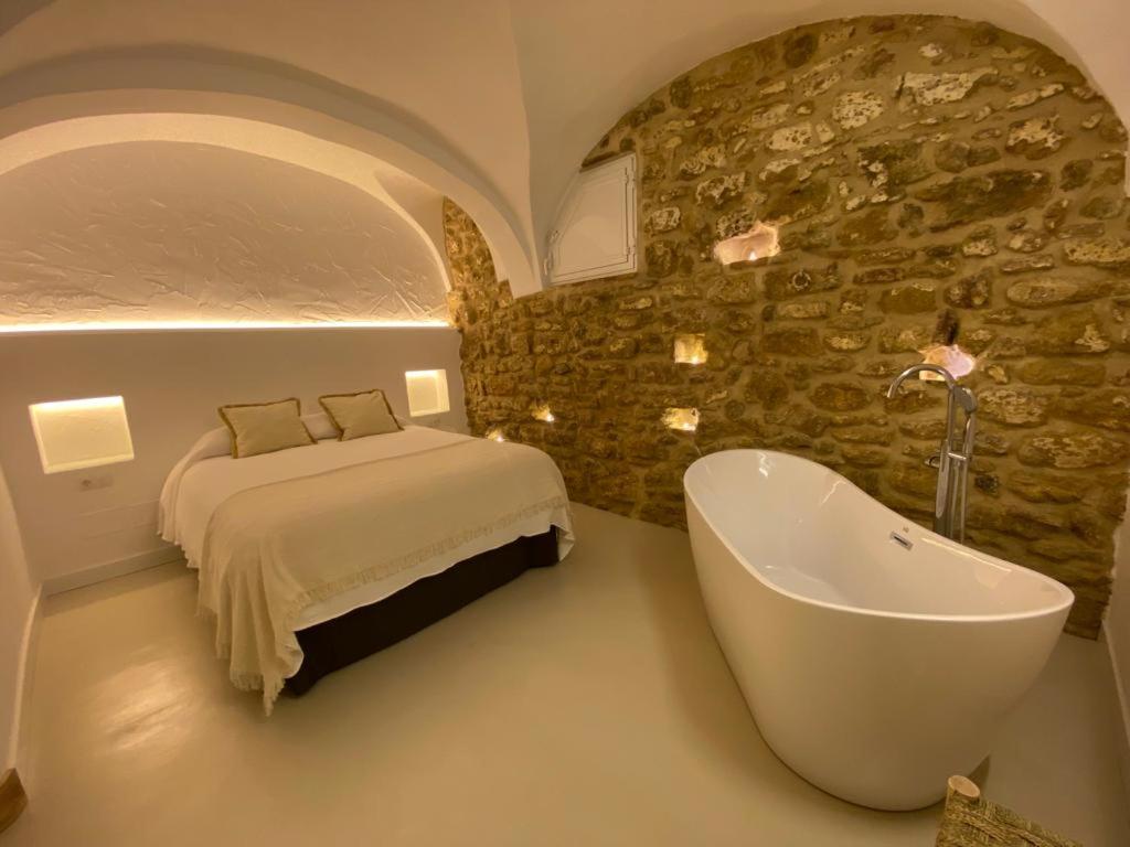 Postel nebo postele na pokoji v ubytování Casa del Sacramento - CASITA CON ENCANTO