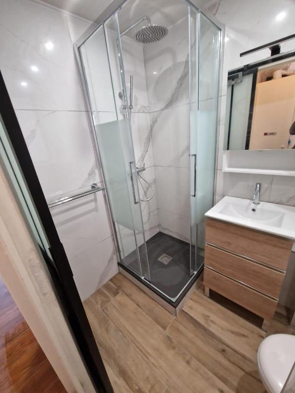 a bathroom with a shower and a sink at L&#39;écrin du Cap Esterel in Saint-Raphaël