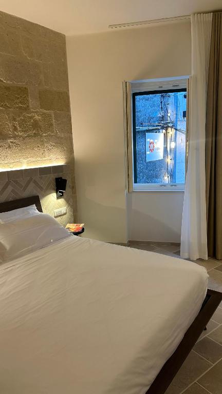 Postel nebo postele na pokoji v ubytování Dimora al Piano