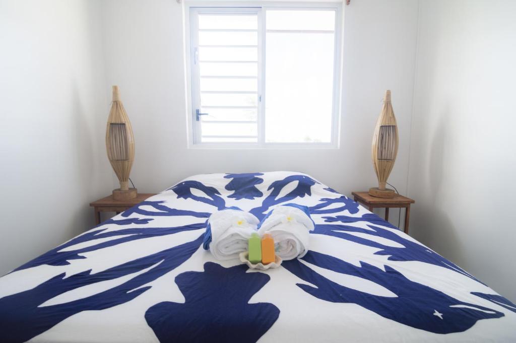 Uma cama ou camas num quarto em Va'a i te Moana