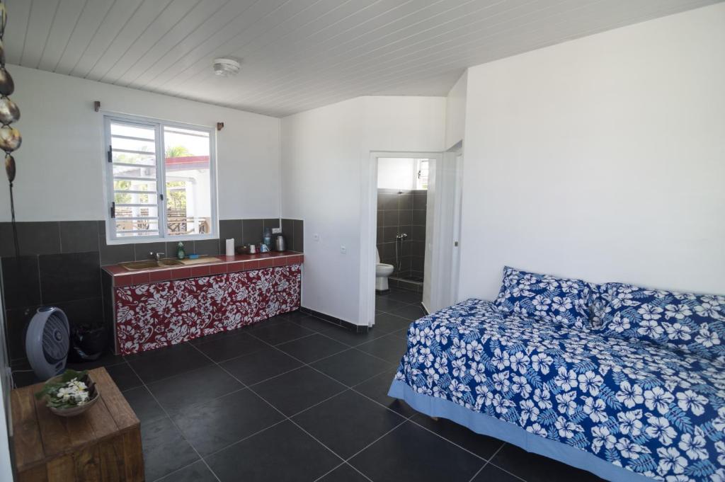 Uma cama ou camas num quarto em Va'a i te Moana