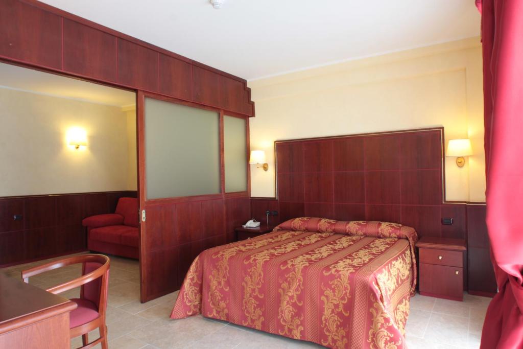 Postel nebo postele na pokoji v ubytování Hotel Relais dei Normanni